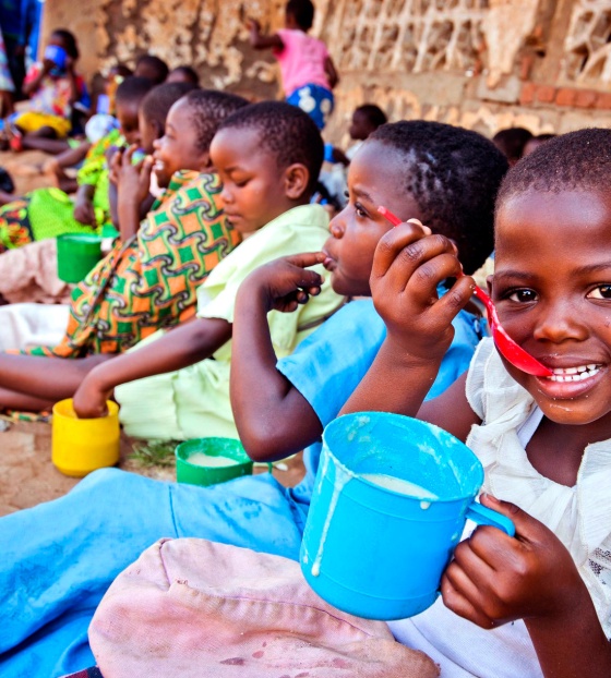 A child enjoys food from Mary's Meals in Malawi